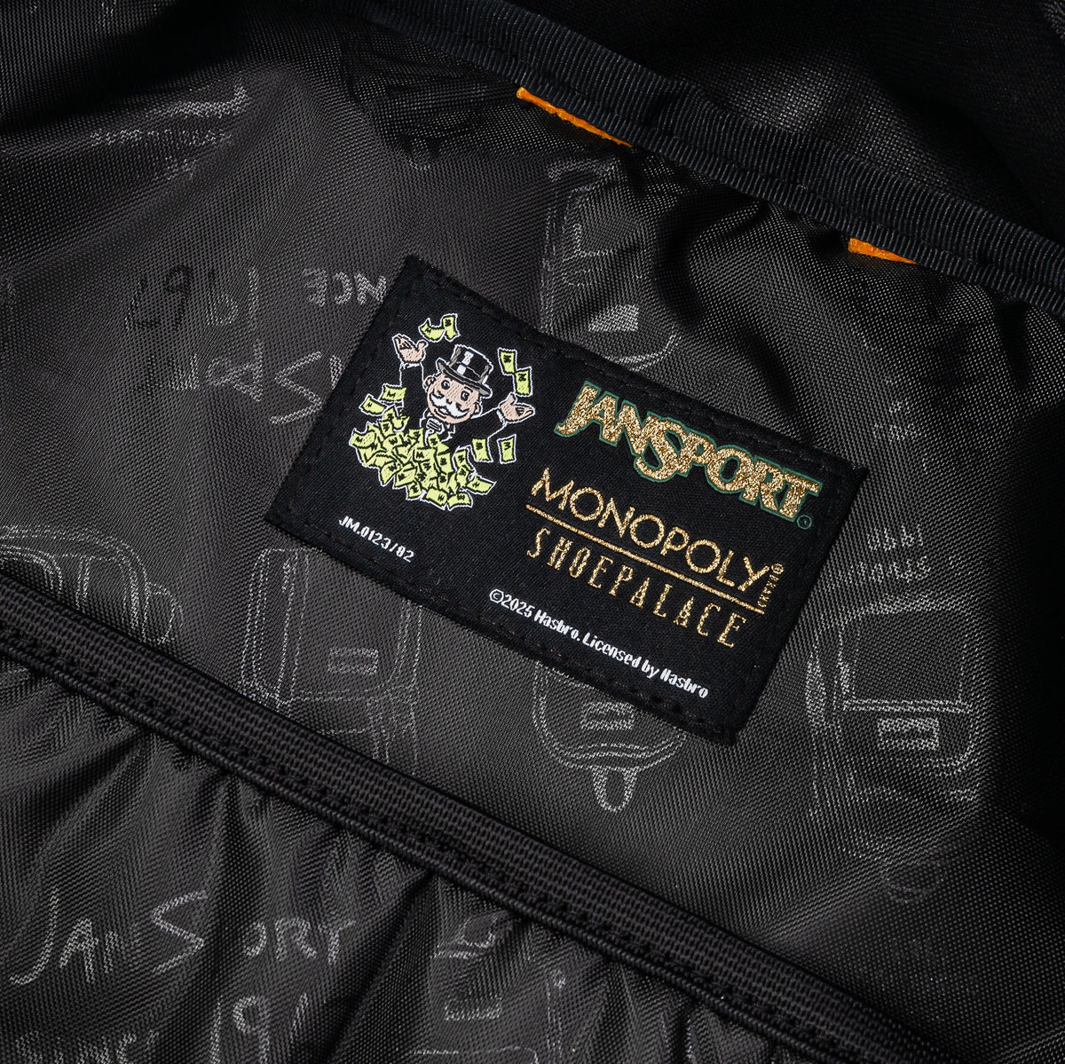 Exclusive Shoe Palace x Jansport x Monopoly Chance Mens Backpack (Black/Orange) — OS — Lifestyle View