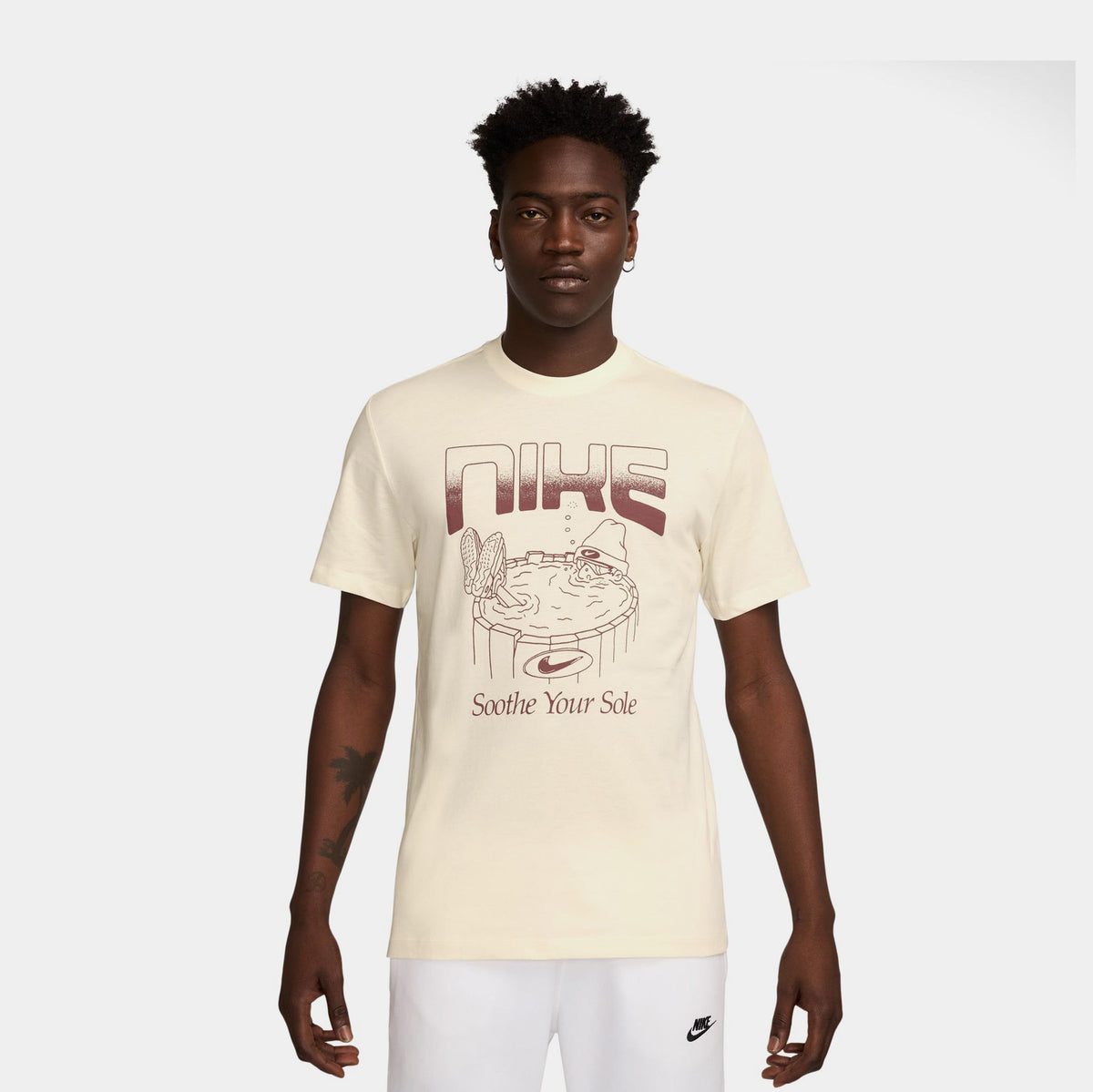 Exclusive NSW Soothe Your Sole Graphic Mens Short Sleeve Shirt (Pale Ivory) — S — Front View