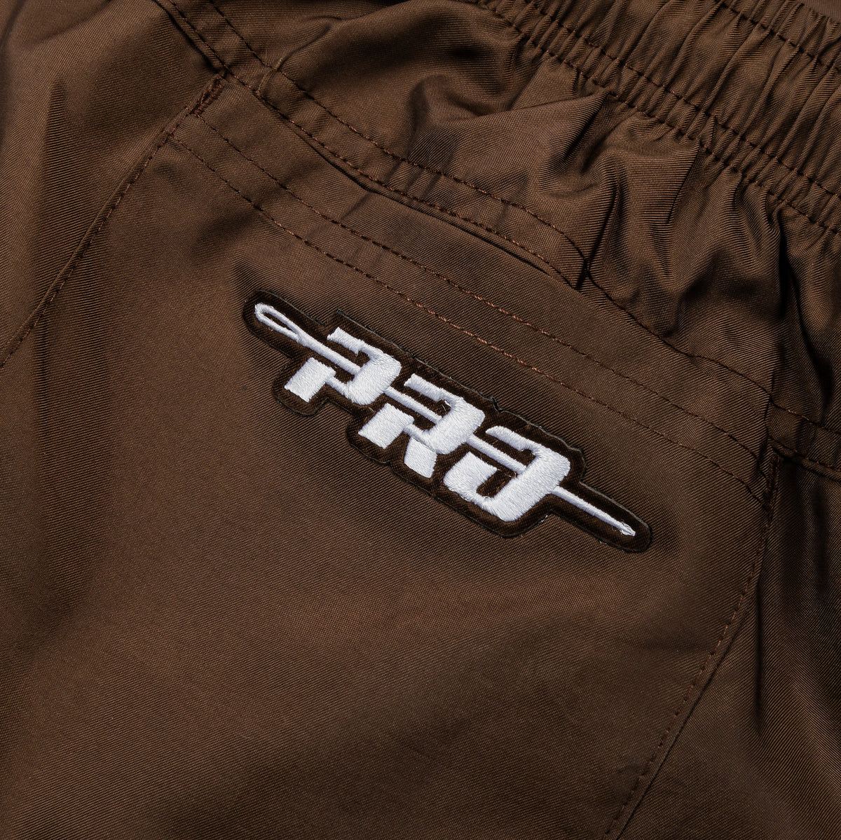 Exclusive San Diego Padres Team Badge Woven Mens Shorts (Brown/Yellow) — S — Top View